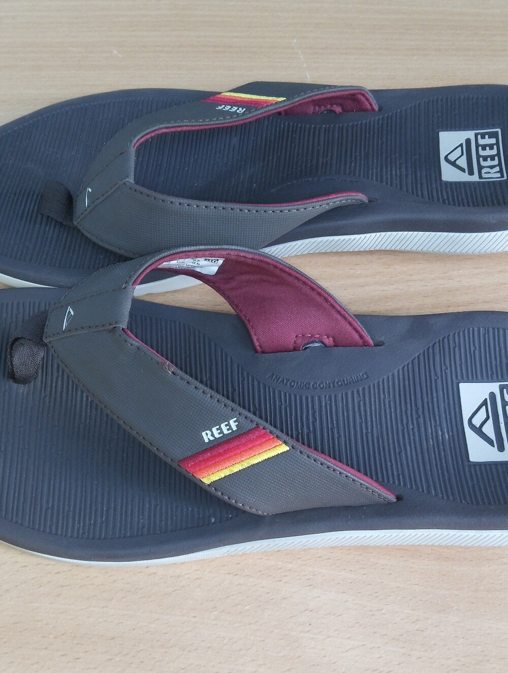 Reef Men's Gray Flip Flops with Burgundy Lining and Red-Orange-Yellow Stripe